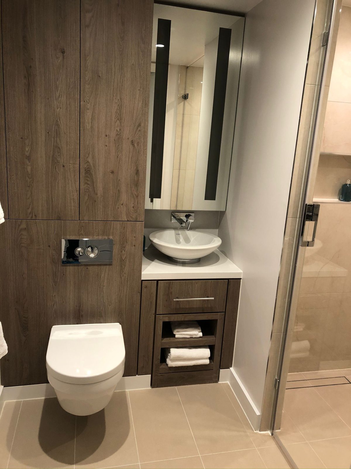 Modern luxury bathroom installation in Bedford with wall-hung toilet and vessel sink