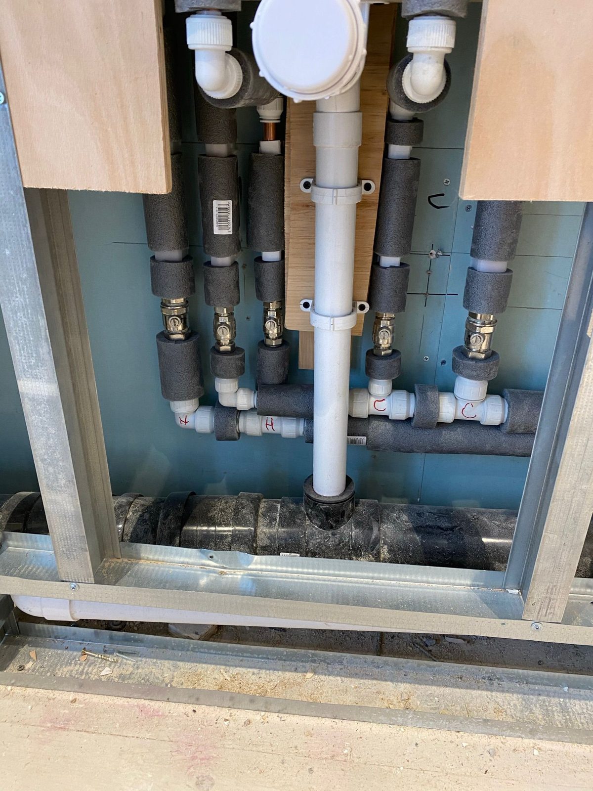 Bathroom plumbing manifold installation Bedford home